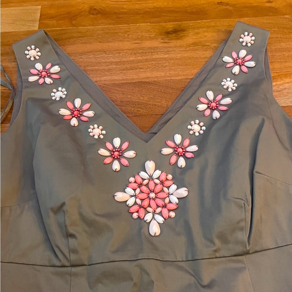 Brown dress with flower detail along neck line